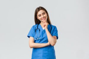 Medical workers, healthcare, covid-19 and vaccination concept. Upbeat smiling pretty nurse, doctor